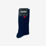 High-cut men's navy crew socks with red embroidered Oaklandish logo at the top wrapped in Oaklandish retail packaging.