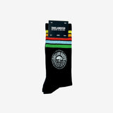 Black crew socks with Oakland Roots Soccer Club colored stripes & logo on top sides in Oaklandish retail packaging.