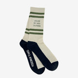 Two nestled white crew socks with Oakland Bay Area California printed in green capital letters & green strips.