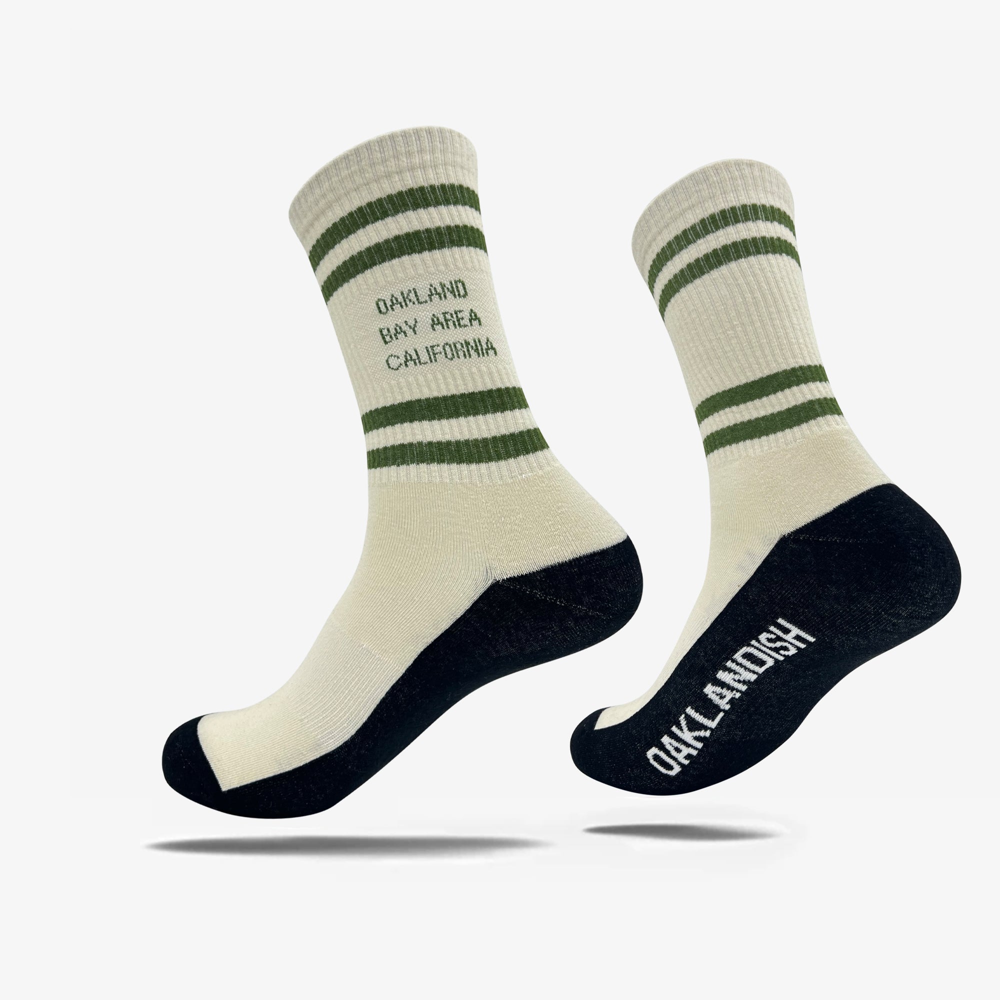 hite socks with Oakland Bay Area California in capital letters with 4 green stripes. Oaklandish wordmark is visible on one black sole.