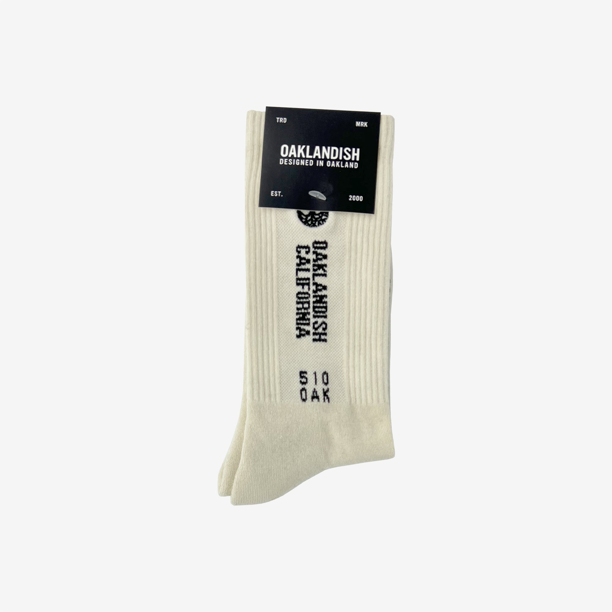 High-cut white crew socks with words Oaklandish California, 510 Oak & Tree Logo in Oaklandish retail packaging.