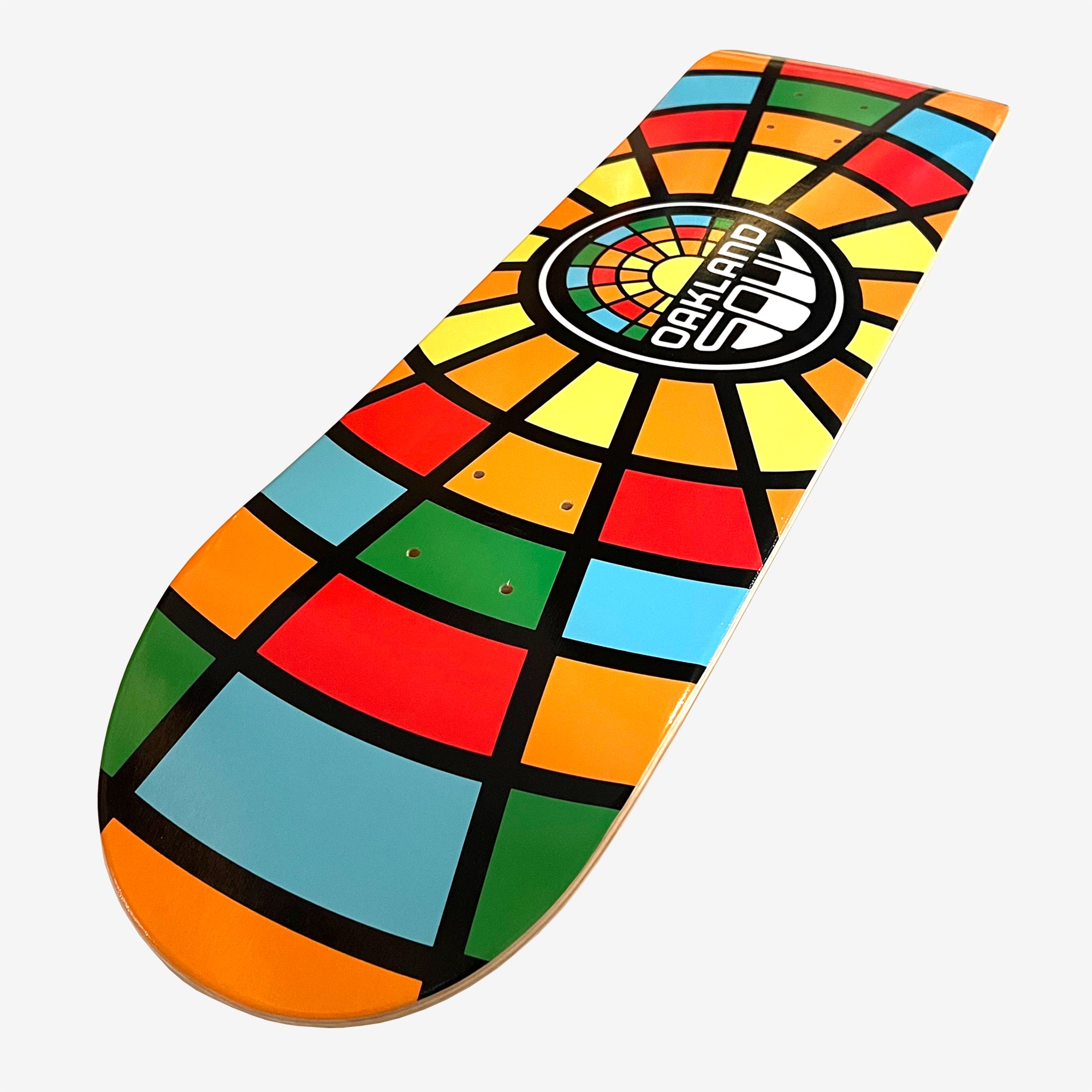 Detailed close-up of the underside of skateboard deck with full-color Oakland Soul mosaic colors and round logo mark