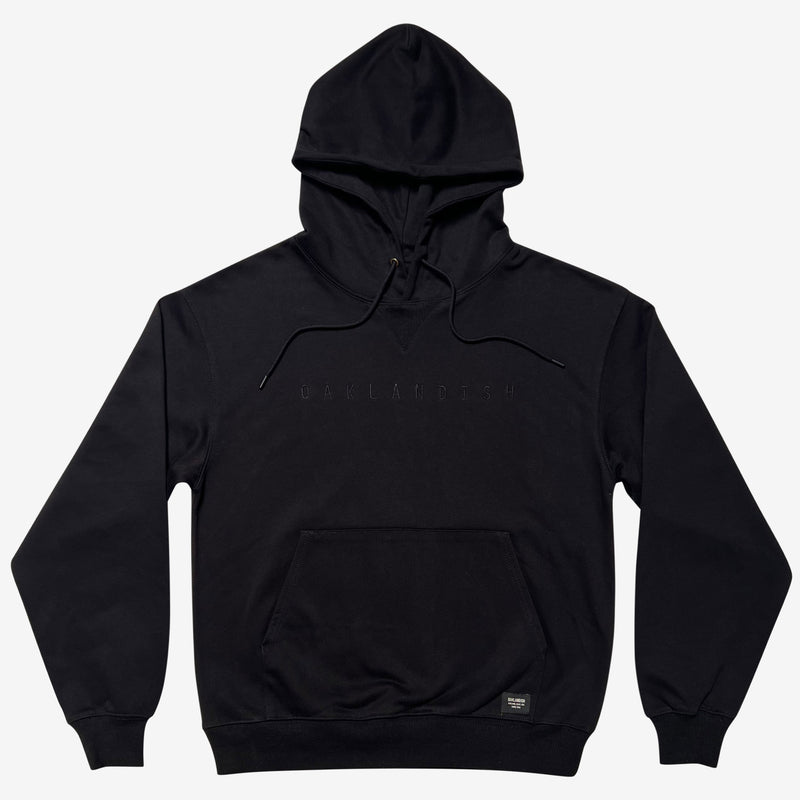 Black pullover hoodie with monochromatic Oaklandish embroidered wordmark on the chest.