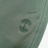 Detail close up of of army standard sweatpants tree logo embroidery .