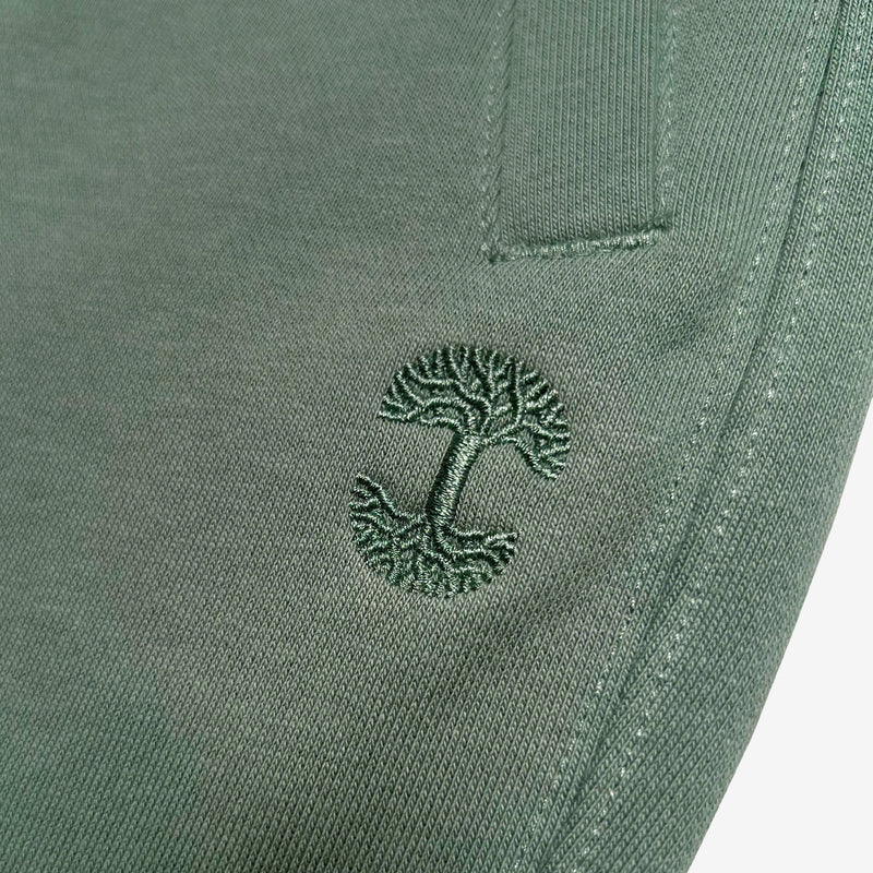 Detail close up of of army standard sweatpants tree logo embroidery .
