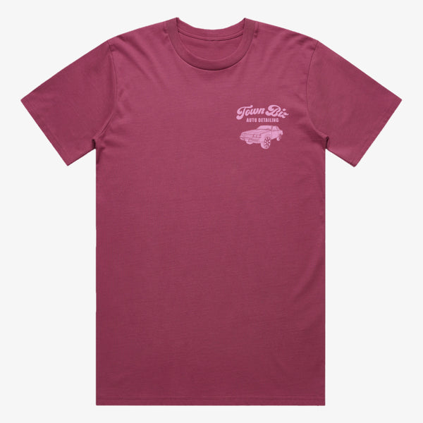 Berry red t-shirt with pink Town Biz Auto dealing wordmark and car on left wear side chest.