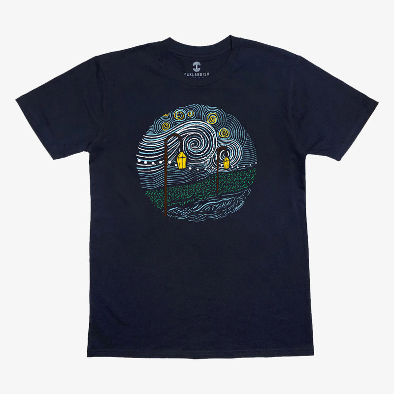 Navy t-shirt with an artistic expressionistic circular image of a starry night, green path and lanterns.