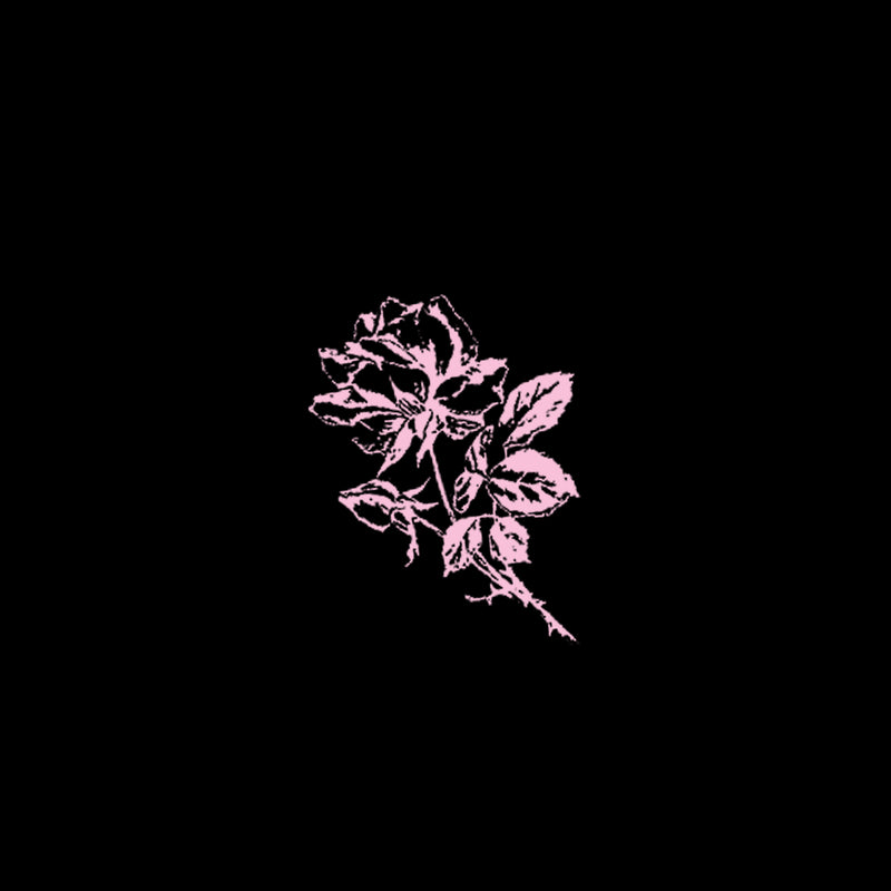 Close up of a hand drawn pink flower on a black t-shirt.