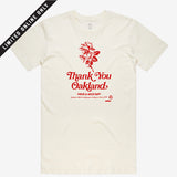 White t-shirt with a red flower and the words “Thank-You Oakland. Have a Nice Day”.
