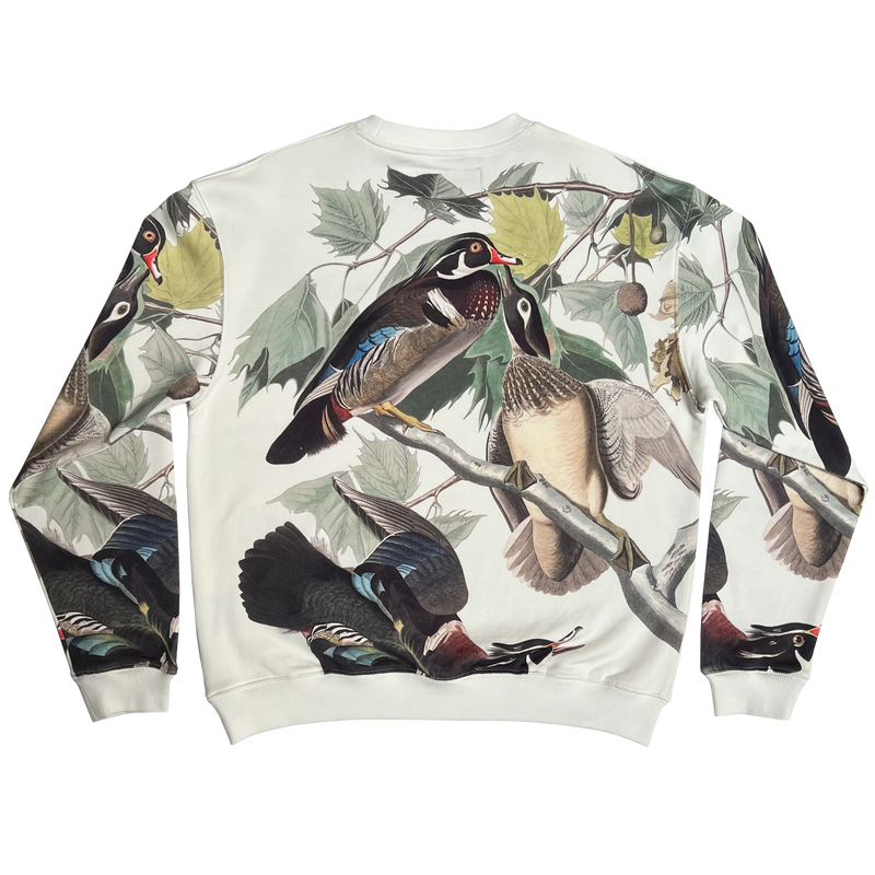 The backside of ducks all over print on cream crewneck Oaklandish sweatshirt.