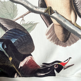 Detailed close up of wood duck all over print on cream crewneck Oaklandish sweatshirt.