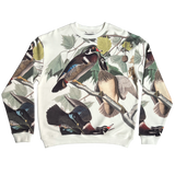 Wood ducks all over print on cream crewneck sweatshirt with Oaklandish tree logo embroidered on wearer's left chest.