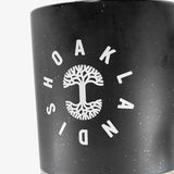 Close up on Oaklandish wordmark circling the Oaklandish tree logo on a stoneware mug.