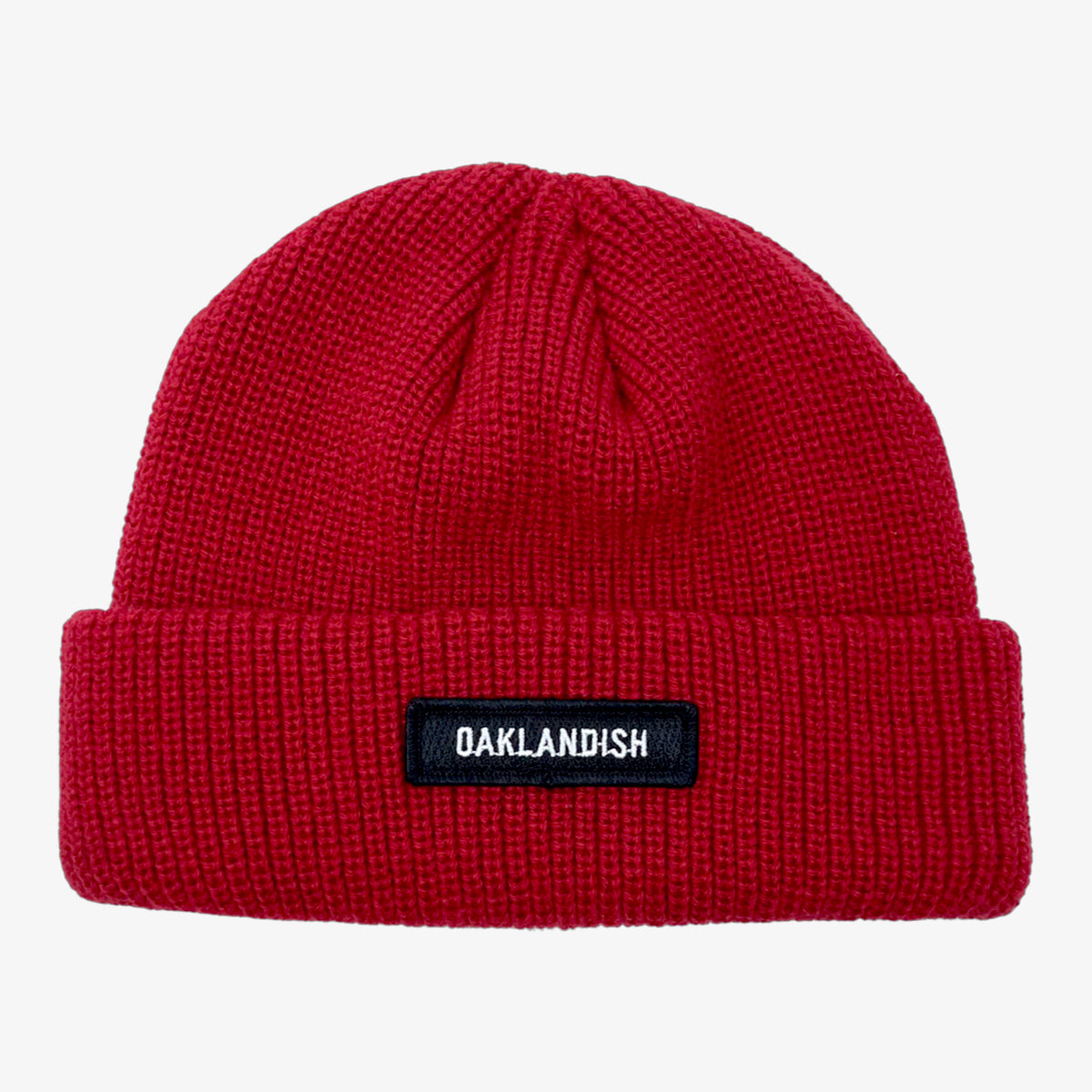 Burgundy shorter style cuff beanie with white Oaklandish wordmark on cuff patch.