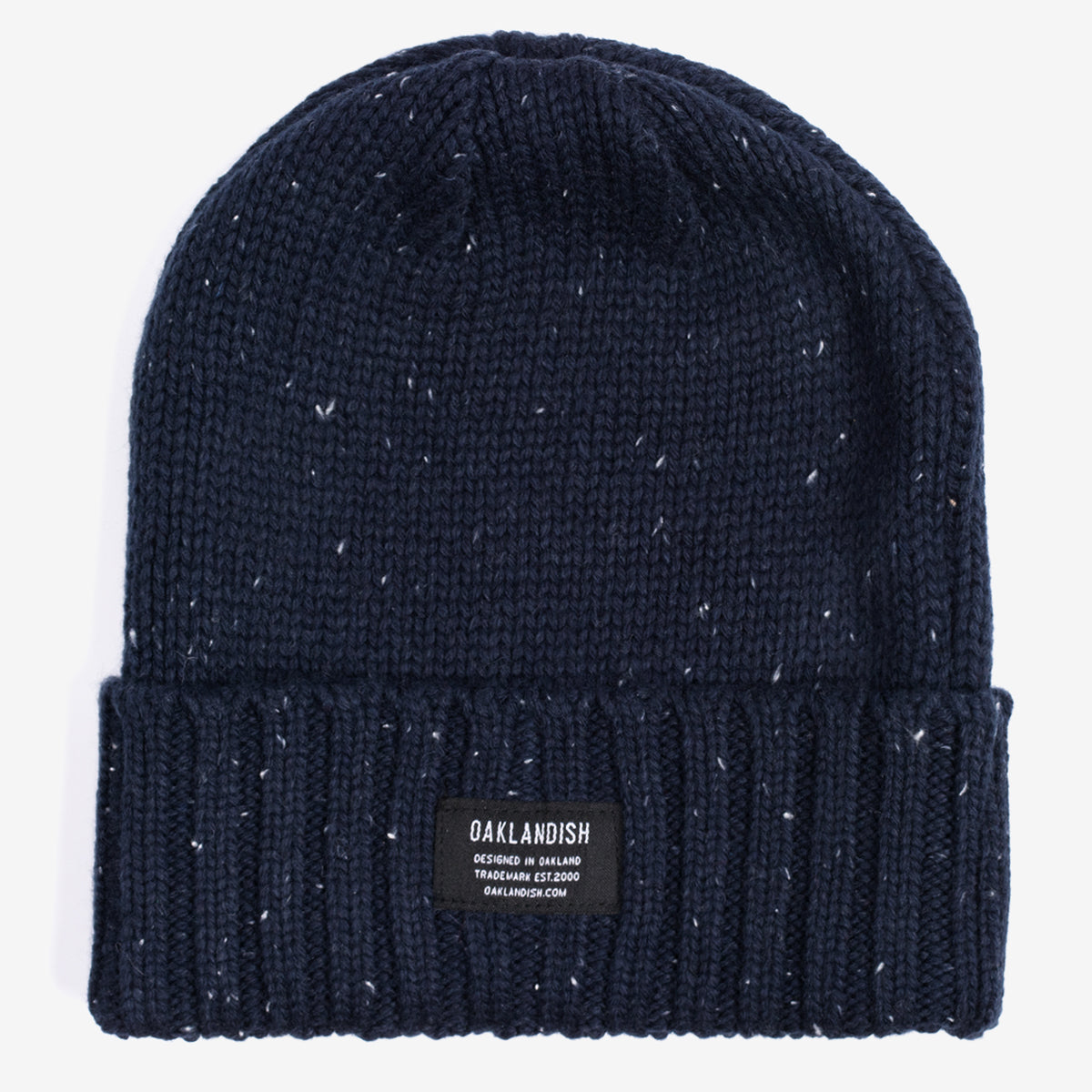 White flecked navy cuffed beanie with Oaklandish tag on the front.