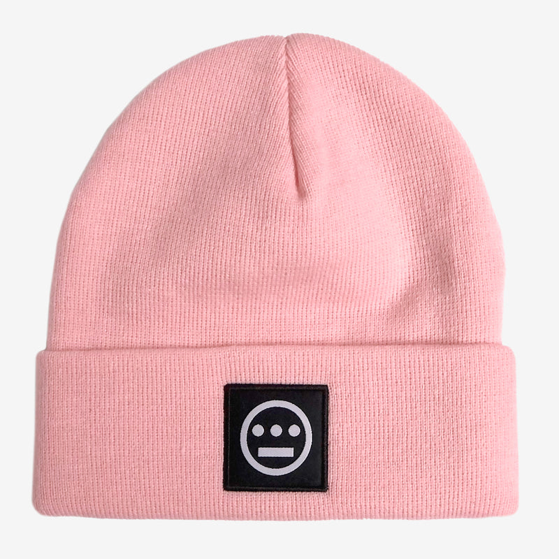 Pink cuffed beanie with black and white hiero hip-hop logo patch on the cuff. 
