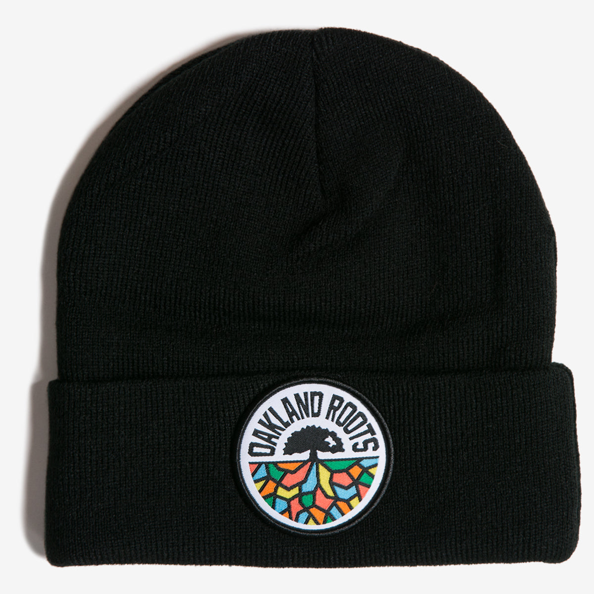 Black acrylic cuffed beanie with a full-color round Oakland Roots SC logo on the front cuff.