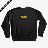 Black crew neck sweatshirt with gold embroidered OAK in bleeding old style font.