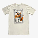 The back side of a natural-color cotton t-shirt with a design featuring California poppies, Oaklandish wordmark, and tree logo.