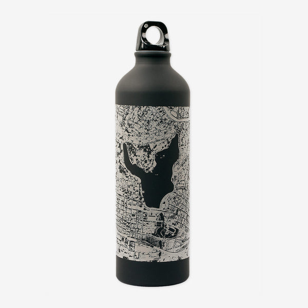 A black water bottle imprinted with an aerial view of a map of Oakland and threaded screw on top with a finger ring.