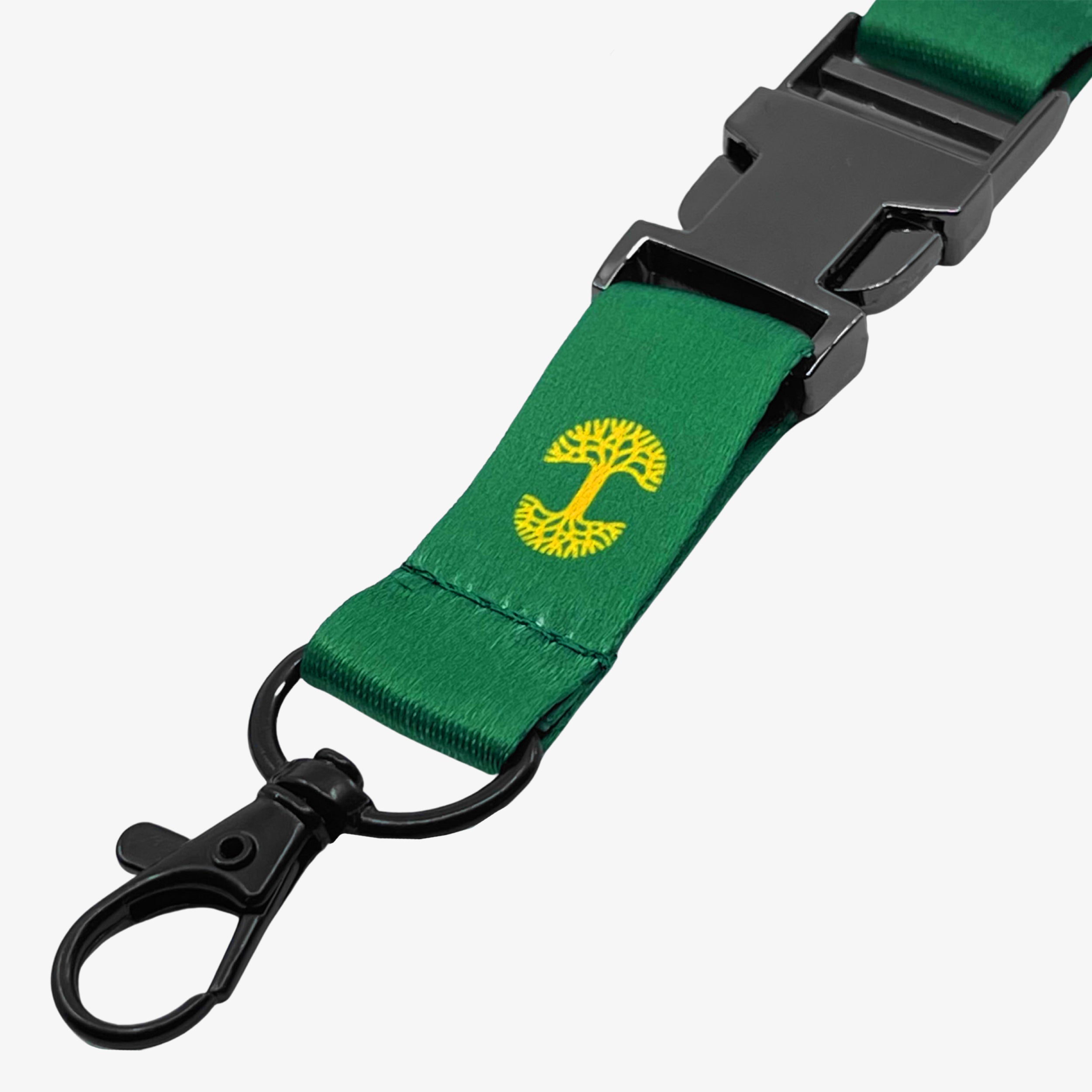 Close up detachable clip with yellow Oakandish tree logo on a green lanyard.