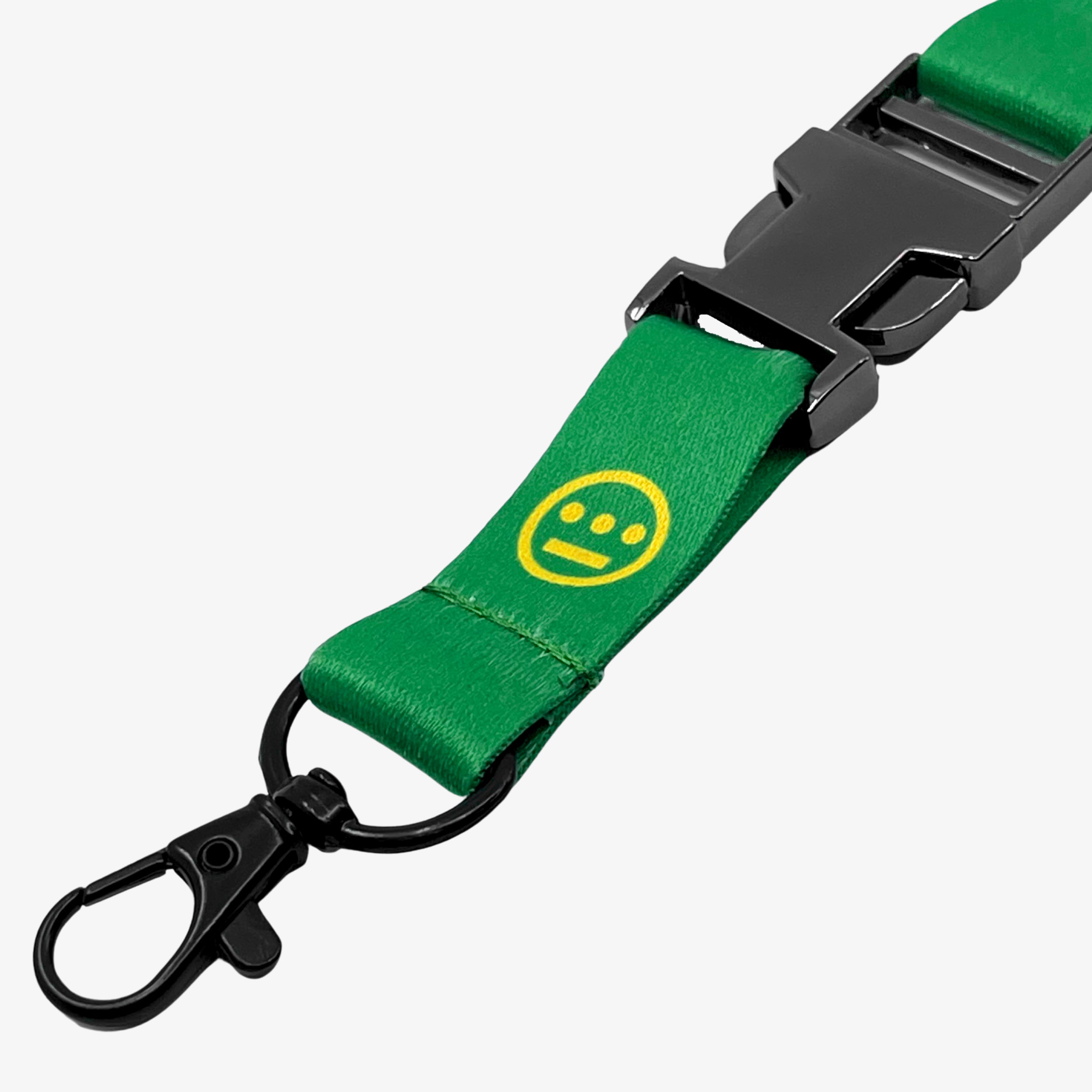 Close-up of quick release clasp on a green lanyard with yellow Hiero hip-hop logo.