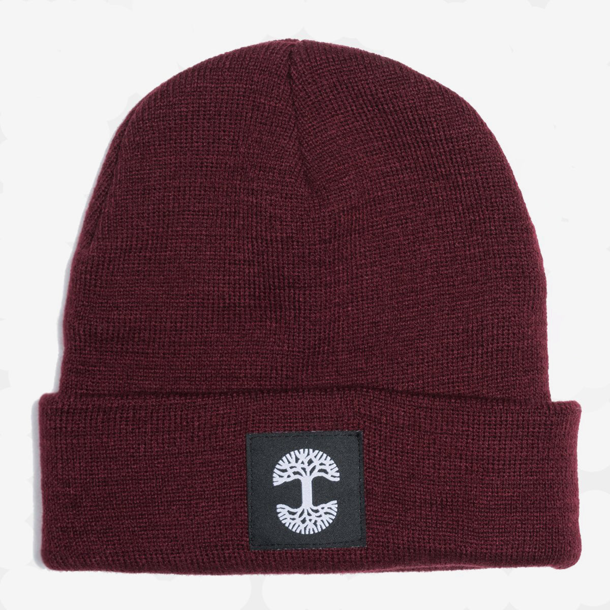 A burgundy woven cuffed beanie with a black and white Oaklandish logo tag on the cuff.