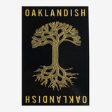 Black rectangular sticker with Oaklandish wordmark and tree logo in gold.