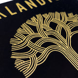 Detailed close-up of gold Oaklandish tree logo on a black rectangular sticker.