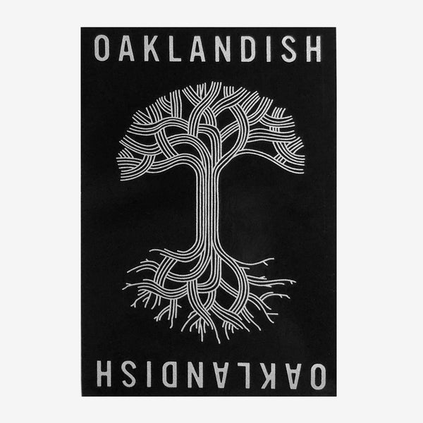 Black rectangular sticker with Oaklandish wordmark and tree logo in silver.
