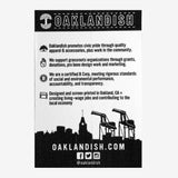 The back side of an Oaklandish sticker with the Oaklandish mission statement printed on it.