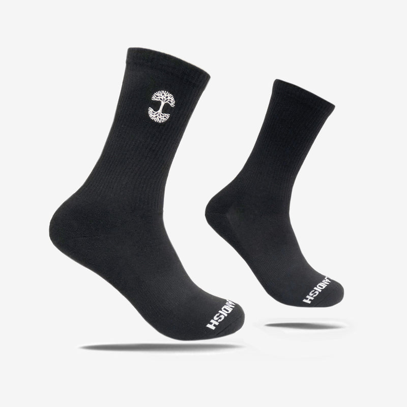 High-cut men's black crew socks with white embroidered Oaklandish logo at the top.