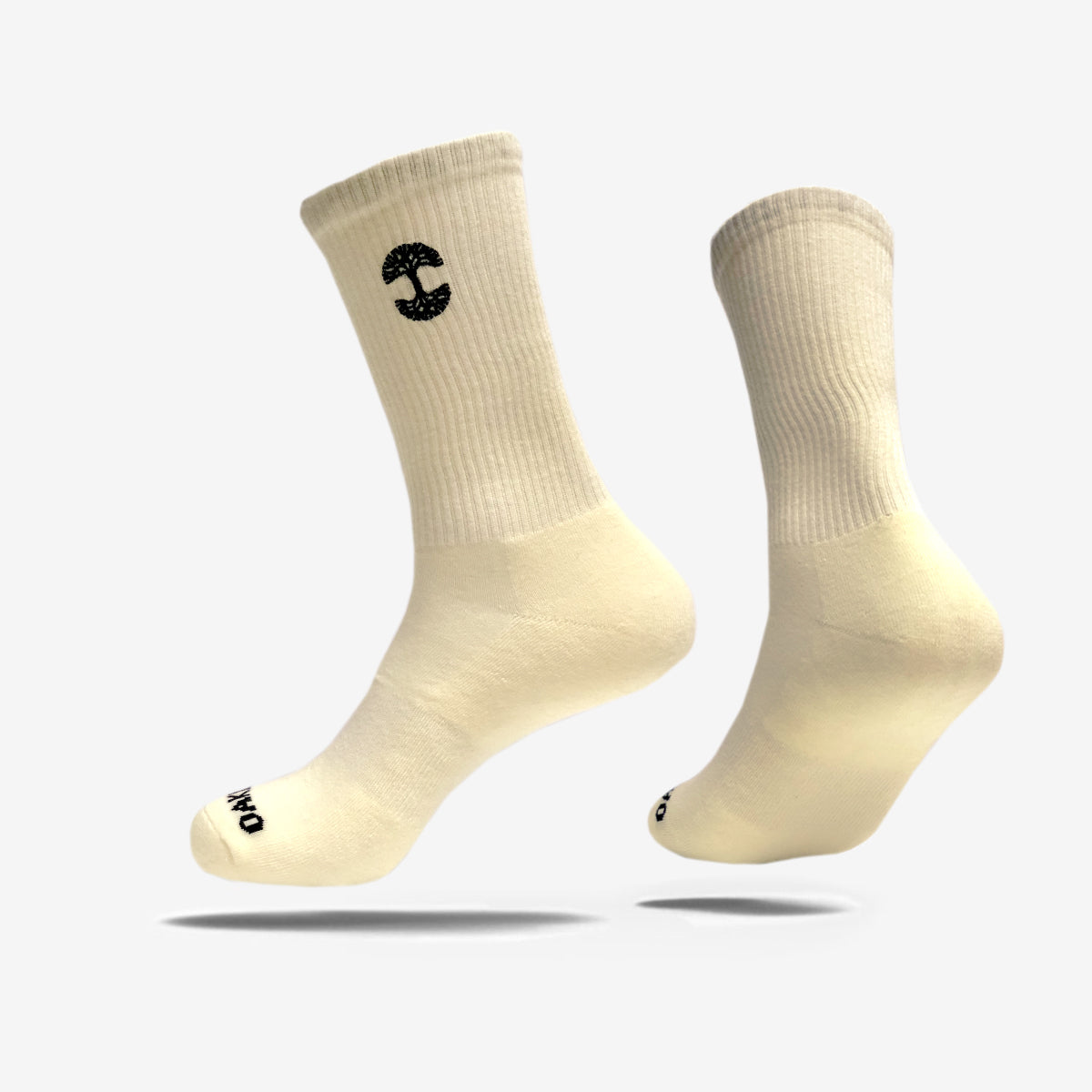High-cut men's cream crew socks with black embroidered Oaklandish logo at the top.