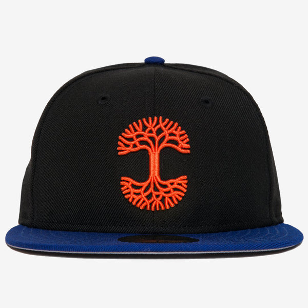 Black New Era cap with blue bill and a red embroidered Oaklandish tree logo on the crown.