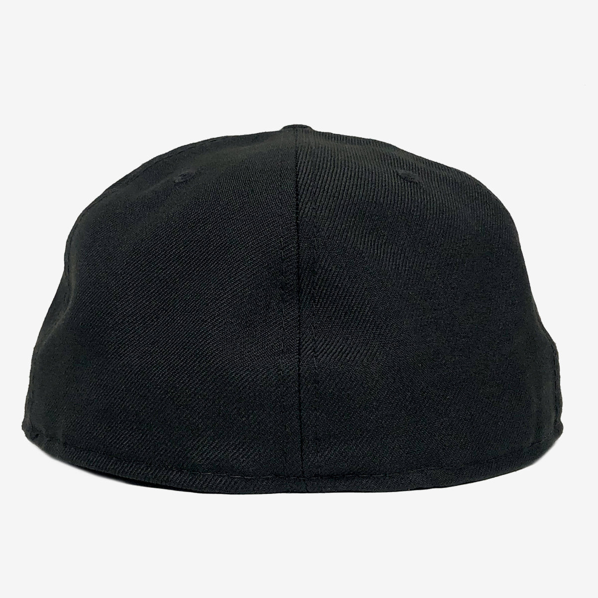 The backside of a black fitted cap. 