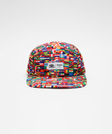 Nylon strap back hat with world flag print all over and embroidered woven label that reads 'Umbro / Akomplice' . 