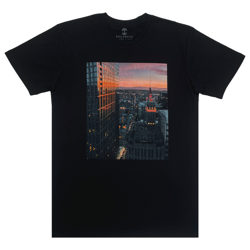 Flat image of black t-shirt with Vincent James photography image of the Oakland Tribune building and the Downtown Oakland landscape.