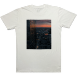 Flat image of natural colored t-shirt with Vincent James photography image of the Oakland Tribune building and the Downtown Oakland landscape.