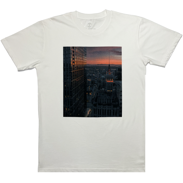 Flat image of natural colored t-shirt with Vincent James photography image of the Oakland Tribune building and the Downtown Oakland landscape.