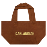 Front view of Ginger shopping tote with Oaklandish wordmark in creme ink creme ink.