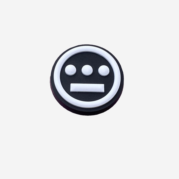 Shoe charm featuring round Hieroglyphics logo in black and white.