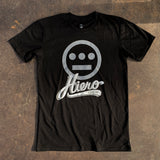 Black t-shirt with gray Hiero hip-hop logo and cursive Hiero Crew wordmark underneath on asphalt.