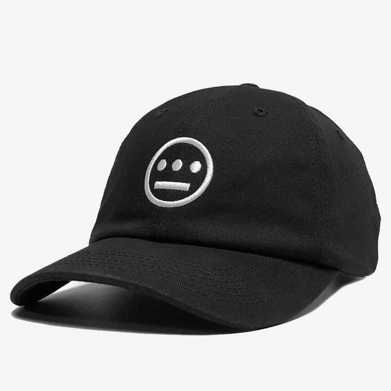 Side view of black dad cap with white embroidered Hiero hip-hop crew logo on crown. 