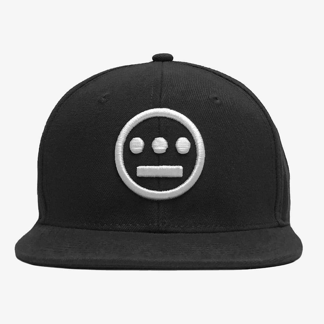The Hieroglyphics brand's Hiero Logo Snapback is a black hat with a flat brim and a button on top, featuring a white embroidered logo on the front. The logo includes a circle with three smaller circles arranged horizontally above a horizontal line within the larger circle, giving it a hieroglyphic appearance.