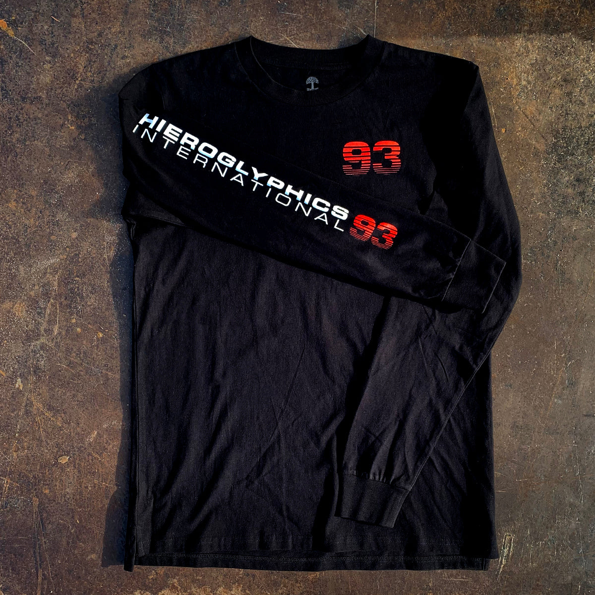 Long sleeve black t-shirt, with Hieroglyphics International 93 wordmark on right sleeve & 93 on the chest on brown background.
