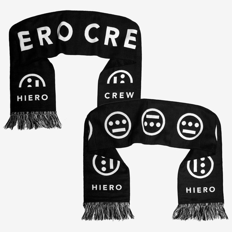Two folded black woven scarves showing reversible sides. One with HIERO CREW hip-hop wordmark and the other with Hiero logo on repeat.