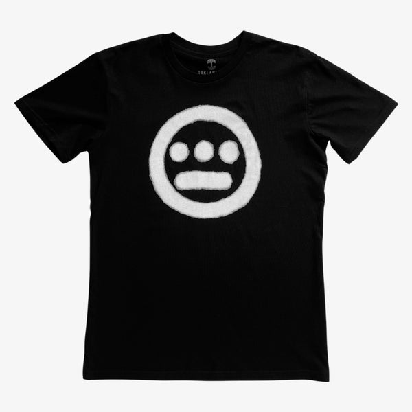 Black t-shirt with aerosol spray painted Hieroglyphics hip-hop logo on chest.