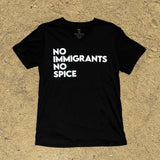 Black V-neck t-shirt with white No Immigrants, No Spice wordmark laying on sand.