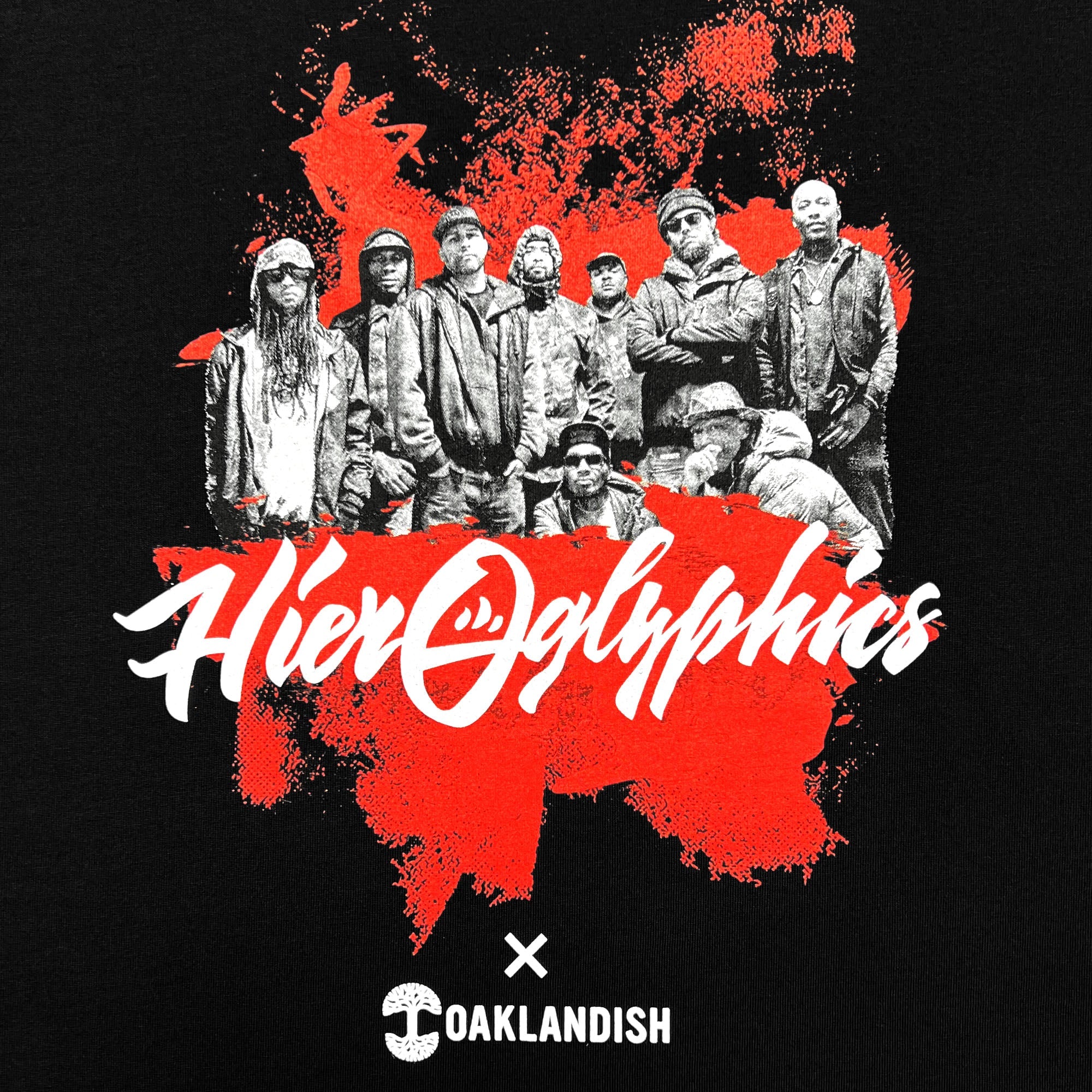 Close-up of an image of Hieroglyphics hip-hop crew and Hieroglyphics X Oaklandish wordmark on a black t-shirt.
