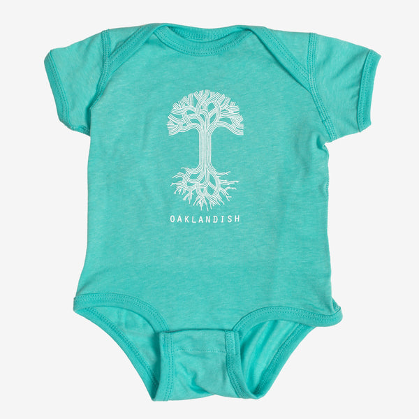 Emerald green infant one-piece with a white Oaklandish tree logo and wordmark on the chest.